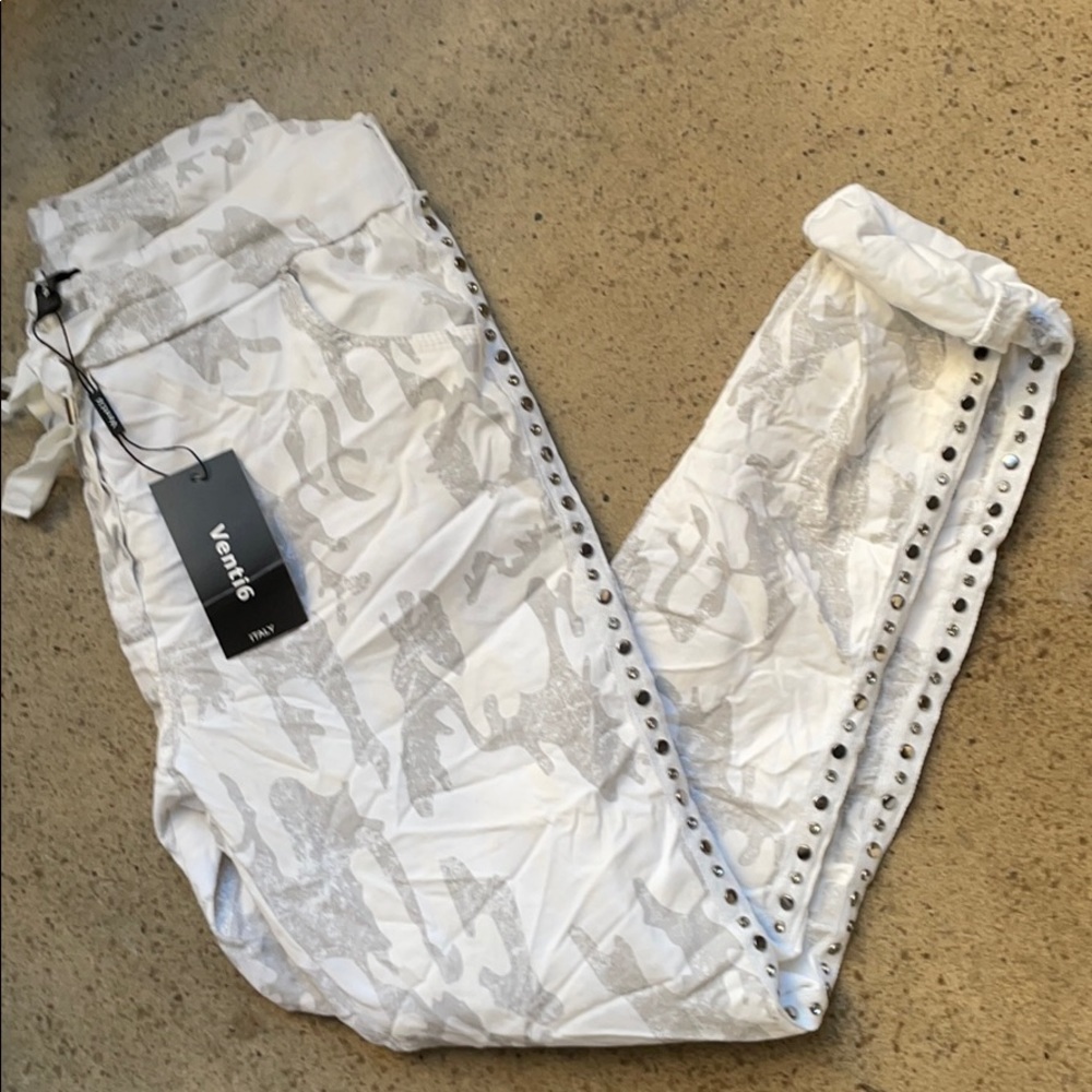 White and gray camouflage joggers.